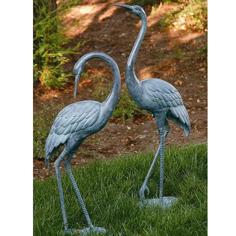Metal crane in garden sculpture