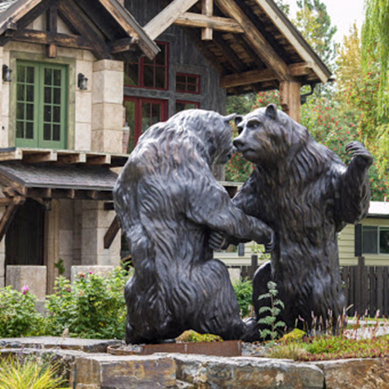 two play-fighting bronze bears sculpture