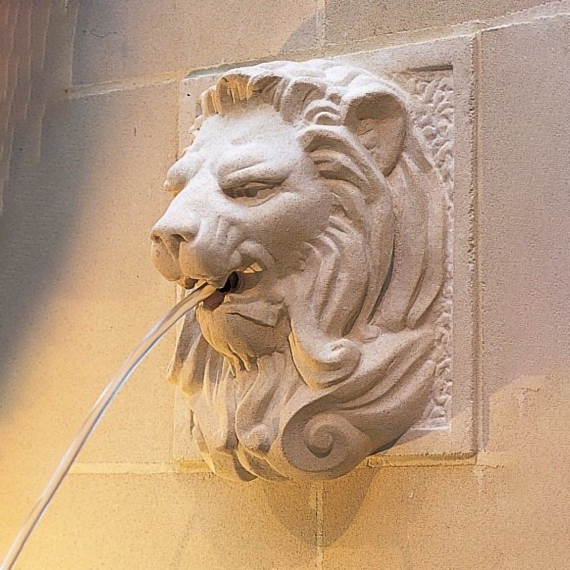 Fountain lion head sculpture