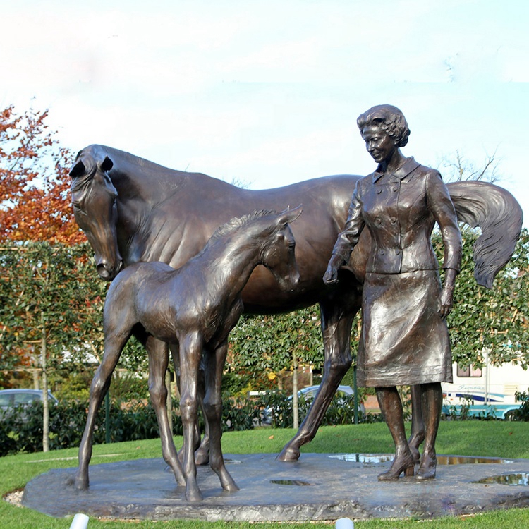 horses and woman sculpture