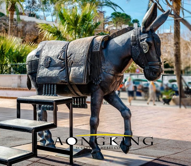 bronze walking donkey statue