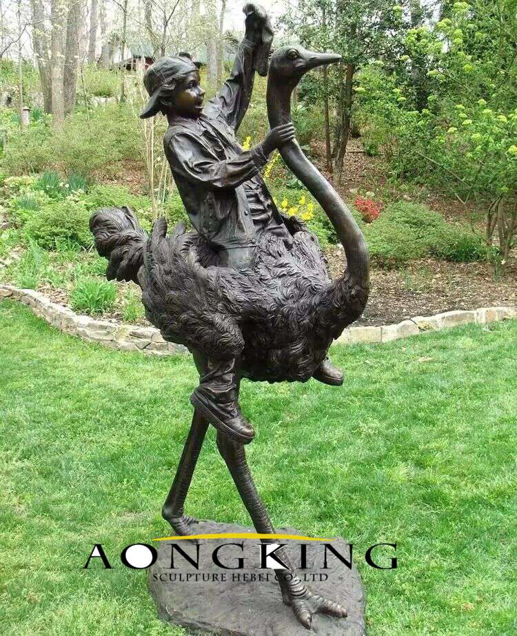 bronze boy riding ostrich sculpture