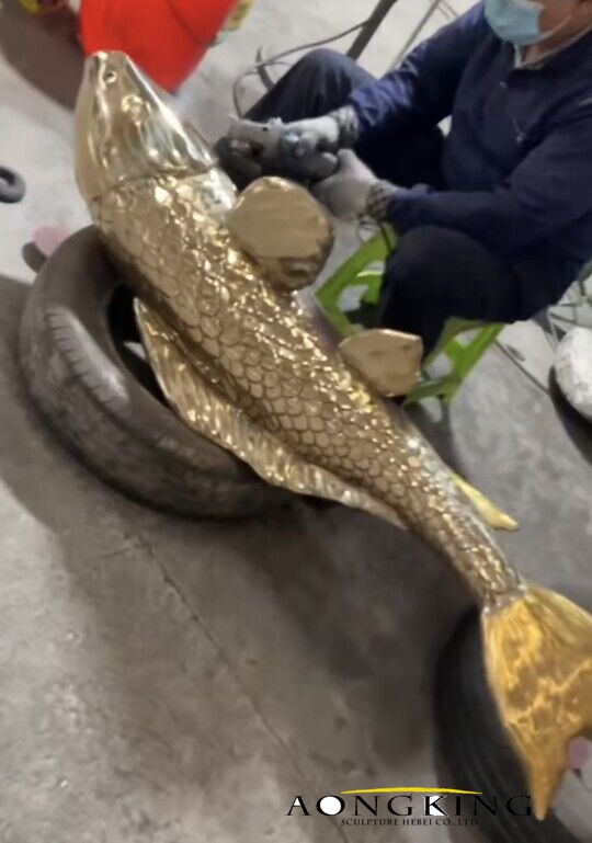 Polished brass barracuda sculpture 2